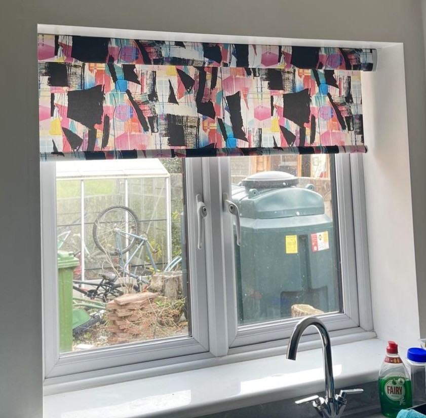 Patterned roller blind fitted to a kitchen window