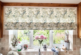 Patterned roman blind installed in a bright kitchen space